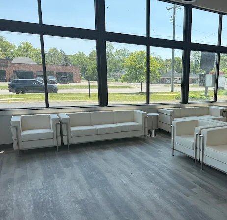 Waiting area at Sylvan Lake Family Practice with lounge seating along floor-to-ceiling windows